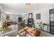 Open living room with hardwood floors, a decorative fireplace, and a large sectional sofa at 418 Geddes Ave, Charleston, SC 29407