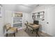 This home office boasts built-in shelving for decor and storage at 418 Geddes Ave, Charleston, SC 29407