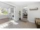Sunroom featuring decorative tile floors, laundry machines, and views of the outdoors at 418 Geddes Ave, Charleston, SC 29407