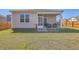 Well-maintained backyard featuring a screened porch and wood fence at 430 Eastern Pine Dr, Summerville, SC 29486
