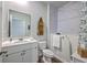 Clean bathroom with white cabinets, a walk-in bathtub, marble tile, and a modern sink at 430 Eastern Pine Dr, Summerville, SC 29486