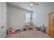 Bright bedroom with desk area, ceiling fan, and neutral carpet flooring at 430 Eastern Pine Dr, Summerville, SC 29486