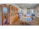 Cozy dining area adjacent to the kitchen with a vintage hutch and dining table at 430 Eastern Pine Dr, Summerville, SC 29486