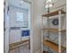 Charming laundry room with floral wallpaper and adjacent shelving unit at 430 Eastern Pine Dr, Summerville, SC 29486