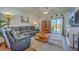 Cozy living room with a comfortable sofa, a glass door to the outside, and a decorative fireplace at 430 Eastern Pine Dr, Summerville, SC 29486