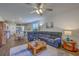 Open-concept living room with a comfortable sofa, an open floor plan to the kitchen, and a ceiling fan at 430 Eastern Pine Dr, Summerville, SC 29486