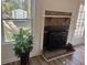 Living room featuring a charming fireplace with brick surround and decorative mantel at 431 Otis Rd, Walterboro, SC 29488