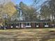 Charming brick home with a well-manicured front yard and beautiful curb appeal surrounded by mature trees at 431 Otis Rd, Walterboro, SC 29488