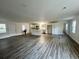 Open-concept kitchen and living space featuring modern appliances, cabinets and flooring at 431 Otis Rd, Walterboro, SC 29488