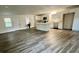 Open-concept kitchen and living space featuring modern appliances, cabinets and flooring at 431 Otis Rd, Walterboro, SC 29488