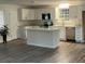 Well-lit kitchen with stainless appliances, granite countertops and a center island at 431 Otis Rd, Walterboro, SC 29488