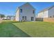 Large backyard with patio, newly installed fence, air conditioning unit, and lush, green grass at 436 Thoroughbred Dr, Moncks Corner, SC 29461