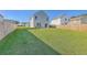 Large, grassy backyard is fully fenced and offers ample outdoor space for recreation and entertaining at 436 Thoroughbred Dr, Moncks Corner, SC 29461