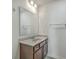 Bathroom vanity with granite countertop, stainless steel hardware, and modern fixtures under a large mirror at 436 Thoroughbred Dr, Moncks Corner, SC 29461