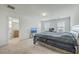 Cozy carpeted bedroom featuring natural light, a neutral color scheme, and an adjacent bathroom for added convenience at 436 Thoroughbred Dr, Moncks Corner, SC 29461