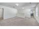 Spacious carpeted bonus room featuring neutral walls and ample natural light from windows, creating an inviting atmosphere at 436 Thoroughbred Dr, Moncks Corner, SC 29461