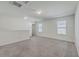 Bright bonus room with plush carpeting, featuring natural light and spacious design suitable for flexible living spaces at 436 Thoroughbred Dr, Moncks Corner, SC 29461