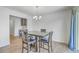 Well-lit dining area with wood floors, featuring a table with chairs and sliding glass doors at 436 Thoroughbred Dr, Moncks Corner, SC 29461