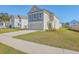 Charming two-story home with a well-maintained lawn and a neutral color scheme at 436 Thoroughbred Dr, Moncks Corner, SC 29461