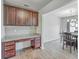 Dedicated home office space featuring granite countertops and dark wood cabinets at 436 Thoroughbred Dr, Moncks Corner, SC 29461