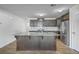Well-lit kitchen with granite countertops, stainless steel appliances, and a center island at 436 Thoroughbred Dr, Moncks Corner, SC 29461