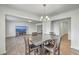 Spacious living space featuring a dining area, living room, and elegant chandelier at 436 Thoroughbred Dr, Moncks Corner, SC 29461