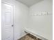 Functional mud room equipped with hooks, a bench, and a door to the outside at 436 Thoroughbred Dr, Moncks Corner, SC 29461