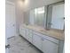 Bathroom featuring double sink vanity with modern faucets and a large mirror at 444 Parish Farm Dr, Summerville, SC 29486