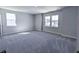 Spacious bedroom with neutral carpet, multiple windows, and ample natural light at 444 Parish Farm Dr, Summerville, SC 29486
