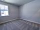 Cozy bedroom with neutral carpet, one window, and ample space at 444 Parish Farm Dr, Summerville, SC 29486