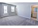 Spacious bedroom with an exterior door and ensuite bathroom, filled with natural light at 444 Parish Farm Dr, Summerville, SC 29486