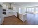 A modern kitchen featuring white cabinets, stainless steel appliances, and a stylish island for meal prep at 444 Parish Farm Dr, Summerville, SC 29486