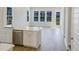 An open floor plan features a kitchen with an island and a combined living space with outdoor views at 444 Parish Farm Dr, Summerville, SC 29486