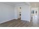 Living room features hardwood flooring, recessed lighting, and white walls leading to the kitchen at 444 Parish Farm Dr, Summerville, SC 29486