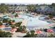 Resort-style pool area with multiple pools, a waterslide, lounge chairs, and lush landscaping at 444 Parish Farm Dr, Summerville, SC 29486