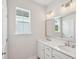 Bright bathroom features a double vanity with white cabinets and quartz countertop at 475 Queenview Ln, Charleston, SC 29414