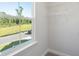 Walk-in closet with shelving and view of street and nearby nature at 475 Queenview Ln, Charleston, SC 29414