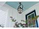 A lantern style porch light with light blue ceiling at 475 Queenview Ln, Charleston, SC 29414