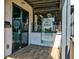 The entrance of Basil Thai Cuisine with the logo on glass and wooden flooring outside at 5040 Lancaster St, North Charleston, SC 29405