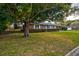 Classic red brick home with mature trees and hedges offers timeless appeal at 5040 Lancaster St, North Charleston, SC 29405