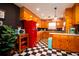 Retro kitchen with wood cabinets, checkered floor, and vintage appliances creates a nostalgic charm at 5040 Lancaster St, North Charleston, SC 29405