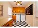 Laundry room features checkered floors, storage cabinets, washer, and dryer at 5040 Lancaster St, North Charleston, SC 29405