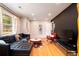 Spacious living room with hardwood floors, stylish furnishings, and ample natural light at 5040 Lancaster St, North Charleston, SC 29405