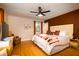 Main bedroom features a plush bed, hardwood floors, and stylish decor at 5040 Lancaster St, North Charleston, SC 29405