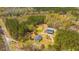 Secluded country estate featuring a home, shop, and pond amid a picturesque wooded landscape at 508 Horse Trail Rd, Saint George, SC 29477