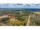 Scenic aerial shot pointing towards the property, nestled amidst lush greenery and mature trees at 508 Horse Trail Rd, Saint George, SC 29477