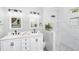 Bathroom with double sinks and walk in shower with white marble tile at 508 Horse Trail Rd, Saint George, SC 29477