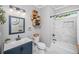 Bathroom featuring a vanity with a sink, toilet, and a tiled bathtub with shower at 508 Horse Trail Rd, Saint George, SC 29477