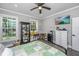 Bright bedroom featuring a ceiling fan, mounted television, and windows with natural light at 508 Horse Trail Rd, Saint George, SC 29477