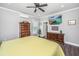Bedroom featuring warm tones, ceiling fan, and wooden dressers at 508 Horse Trail Rd, Saint George, SC 29477